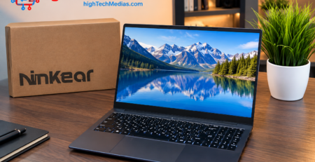 Ninkear laptop on a professional wood desk with mountain lake display, Ninkear box, and potted plant