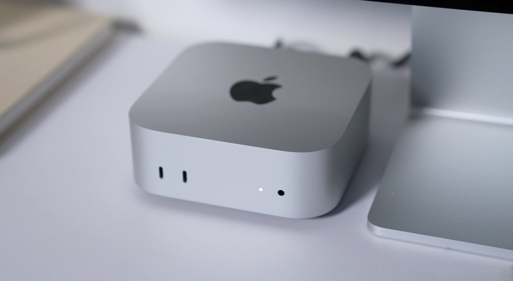 apple-mac-mini-m4-pro.jpg Compact silver Apple Mac mini M4 Pro desktop workstation showing front power indicator and rear connectivity ports.